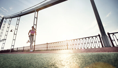 Wall Mural - Sports buckground. The woman with runner on the street be running for exercise