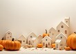Fall decor with cozy pumpkins and decorative houses. Thanksgiving and Halloween concept.