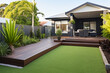 A contemporary Australian home or residential buildings front yard features artificial grass lawn turf with timber edging. ai generative