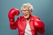 Elderly senior woman wearing red boxing gloves, confident smiling expression ready for fight. Wide banner copy space on side | Generative AI