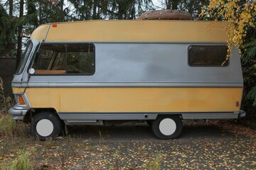 Wall Mural - Abandoned caravan, motorhome in the parking lot, in a historic, retro style