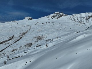 Sticker - Scenic view of a snow-capped mountain range in Swiss Alps in winter