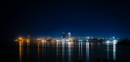 Wall Mural - a large body of water that is lit up at night