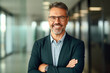 © Impressionstock - Happy and Confident Middle-Aged Businessman Flourishing as a Bank Manager
