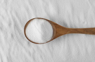 Wall Mural - Kitchen salt in wooden spoon background
