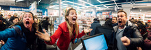 Woman excited happy in electronics store with black friday special offer