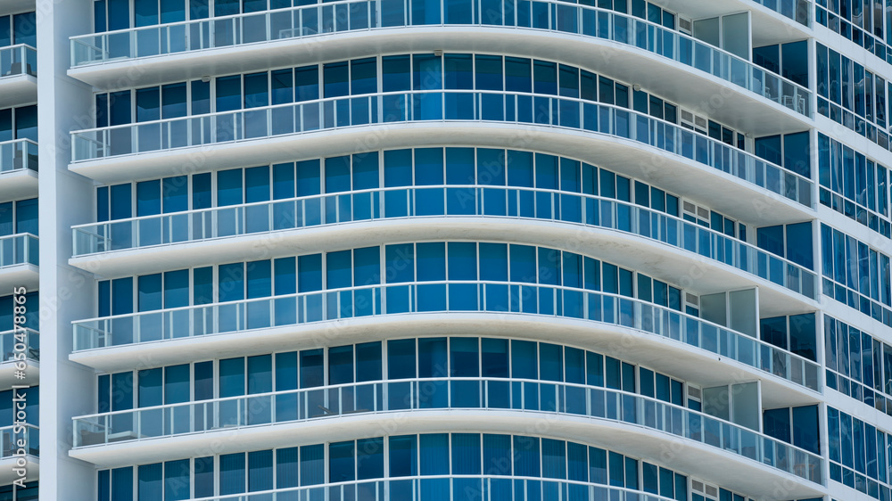 Abstract exterior of modern high rise apartment building with ...