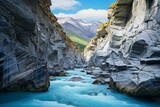 Fototapeta Łazienka - A majestic river flowing through a breathtaking canyon surrounded by towering mountains