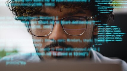 Programmer coding on laptop with digital virtual script