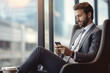 © Golden House Images - Businessman using smart phone at office with city uildings background.