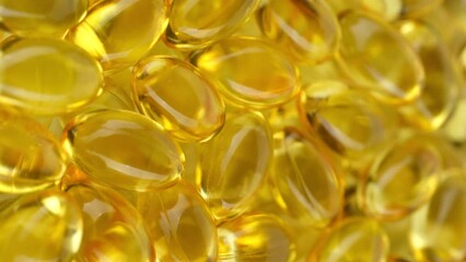 Wall Mural - Zoom frame yellow softgel capsule Vitamins Omega 3 or fish oil. Vertical video