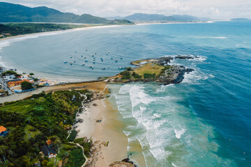 Coastline with beach and ocean with waves in Brazil. Aerial view of Matadeiro Beach in Santa Catarina