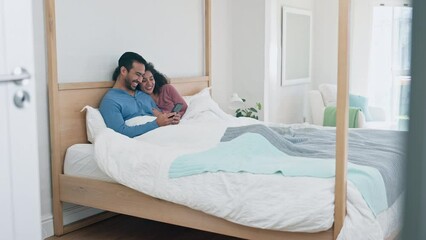 Wall Mural - Couple, bed and phone with relax in morning or communication in embrace or nap. Happy partnership, comfort and laugh or wake up in apartment or together for care, relationship or connection online