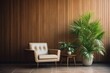 © Md Shahjahan - A lounge chair finds its place near a wood paneling wall, nestled between potted houseplants, in a mid century home interior design for the modern living room.