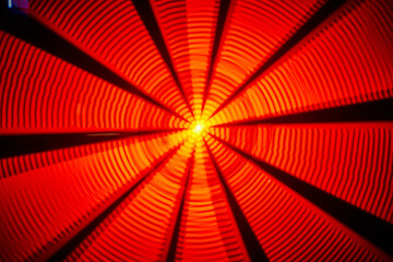 abstract background asset of yellow sun center with rippling red and orange light and black lines