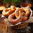 Homemade whole meal pretzels with sesame and salt on basket on wood table
