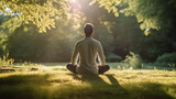 Fototapeta  - Man finding inner peace, meditating amidst the green serenity of a peaceful park