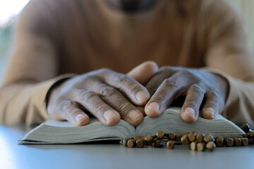 man praying with bible with black background with people stock image stock photo