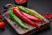 Hot Chili Peppers Of Three Different Colors Red, Green And Yellow