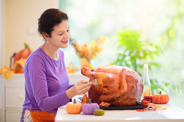 Wall Mural - Family cooking Thanksgiving dinner