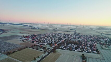 Wall Mural - drone footage of a german town during sunset with large fields