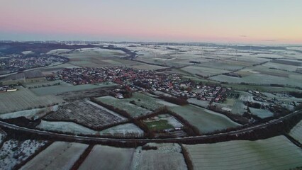 Wall Mural - drone footage of a german town during sunset with large fields