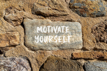 Wall Mural - Motivate yourself symbol. Concept words Motivate yourself on beautiful big stone. Beautiful stone wall background. Business psychology motivate yourself concept. Copy space.