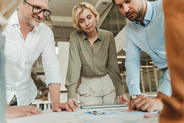 Portrait of group businesspeople standing near desk, workplace working together in modern office