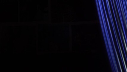 Wall Mural - abstract bright blue neon strip glowing fast moving streams of light on black background