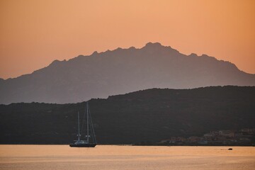 Poster - Boat against the stunning views of Cala Moresca, in Sardinia, Italy