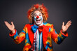 © MVProductions - Funny laughing clown dressed in colorful clothes. Entertainment for children and adults, circus clown