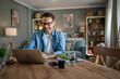 © Miljan Živković - one man adult caucasian work on laptop at home happy smile