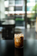 © pariwatpannium - Iced coffee in a coffee shop blur background with bokeh image