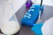 © Microgen - An expert assesses milk quality in a laboratory, using test tubes for analysis.