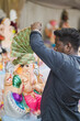 © GraphicGearsCom - An Artist gives finishing touches to an idol of Hindu elephant-headed god Ganesh at a workshop