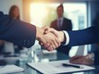 © VisionalMedia - Business partners, people shaking hands, finishing up a meeting or negotiation in a modern office building. Teamwork, business handshake concept.. close-up.