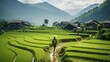 A village with a man walking through the rice fields