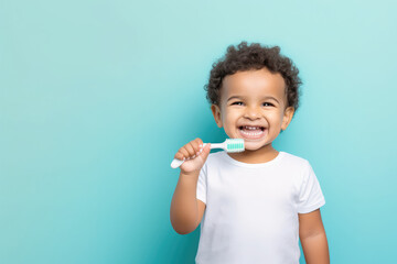 Wall Mural - Kid brushing teeth isolated on pastel blue background