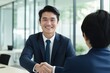© CYBERUSS - Portrait of Smiling Businessman Greeting Client in Office, Happy Manager Discussing with Partner, Recruiting Job Interview