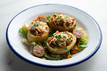 Canvas Print - Potatoes stuffed with minced meat and tomato and baked in the oven with cheese.