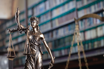 Wall Mural - Law theme. Themis statue, scale and judge gavel in the law faculty library.