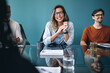 © Jacob Lund - Team of professionals collaborating on a project in a boardroom