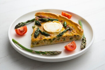 Poster - French style quiche with green asparagus, eggs, and slices of goat cheese.