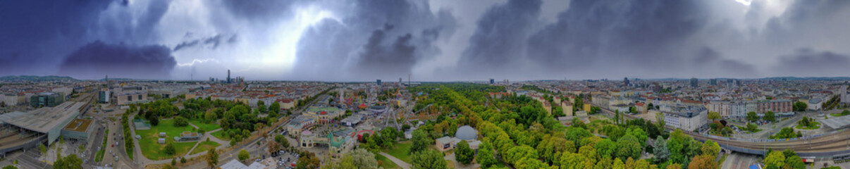 Wall Mural - Vienna, Austria. Panoramic aerial view of Prater area and city skyline during a storm