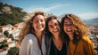 © Keitma - Travel photo of three girl friends, all smiling and happy with beautiful landscape