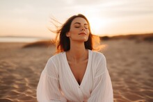 Portrait Gorgeous Charming Relaxed European Woman Lady Girl Female Sitting Performing Meditation Beach Sand Ocean Sea. Vacation Trip Mental Health Care Happy Traveler Holiday Soul Rest Wellness Yoga