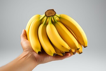 Wall Mural - Bunch of ripe bananas holding on a hand isolated on white background