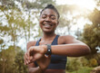© Siphosethu/peopleimages.com - African runner woman, smart watch and park for check, smile or happy for time, results or fitness in nature. Girl, iot clock and monitor for speed, heart rate or smile for exercise, workout or health