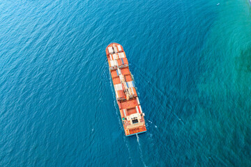 Top view Logistics and transportation of Container Cargo ship and Cargo plane with working crane bridge in shipyard at sunrise, logistic import export and transport industry background