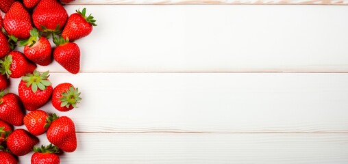 Wall Mural - fresh strawberries on top of white wood table,